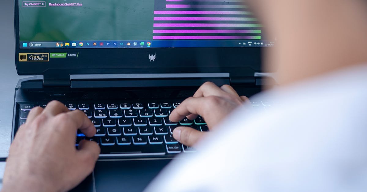 Focused shot of a man using ChatGPT on laptop. Ideal for tech-related content.